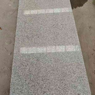 周口芝麻白光面毛板